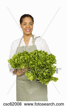 Stock Photo - woman holding 
fresh produce. 
fotosearch - search 
stock photos, 
pictures, images, 
and photo clipart