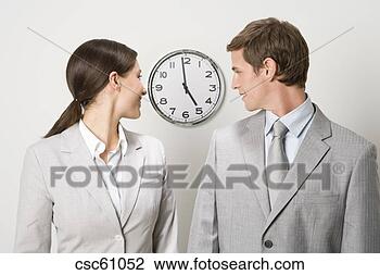 Stock Photo - business people 
looking at clock. 
fotosearch - search 
stock photos, 
pictures, images, 
and photo clipart