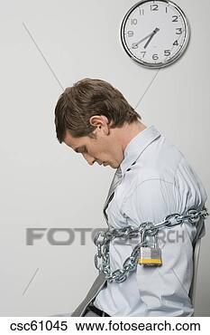Stock Image - businessman chained 
and locked. fotosearch 
- search stock 
photos, pictures, 
images, and photo 
clipart