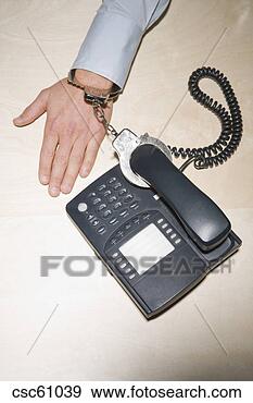 Stock Photograph - businessman handcuffed 
to telephone. 
fotosearch - search 
stock photos, 
pictures, images, 
and photo clipart
