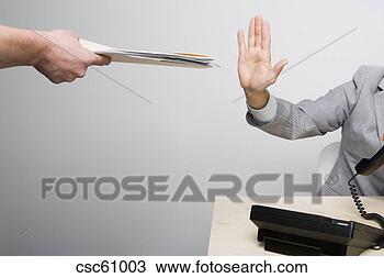 Stock Photo - businessman holding 
hand up to paperwork. 
fotosearch - search 
stock photos, 
pictures, images, 
and photo clipart