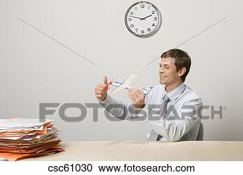 Stock Photography - businessman holding 
toy airplane. 
fotosearch - search 
stock photos, 
pictures, images, 
and photo clipart