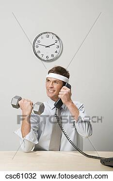 Stock Photo - businessman lifting 
weight while talking 
on telephone. 
fotosearch - search 
stock photos, 
pictures, images, 
and photo clipart