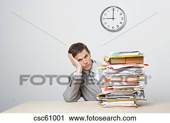 Stock Photography - businessman next 
to stack of paperwork. 
fotosearch - search 
stock photos, 
pictures, images, 
and photo clipart