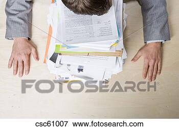 Picture - businessman resting 
head on stack 
of paperwork. 
fotosearch - search 
stock photos, 
pictures, images, 
and photo clipart