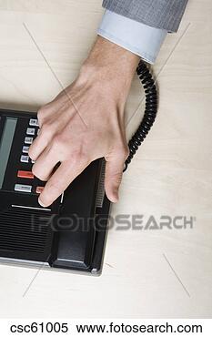 Stock Image - businessman’s 
hand on telephone 
receiver. fotosearch 
- search stock 
photos, pictures, 
images, and photo 
clipart
