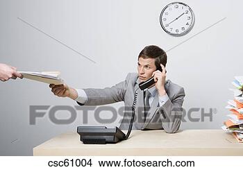 Stock Photo - businessman talking 
on telephone. 
fotosearch - search 
stock photos, 
pictures, images, 
and photo clipart