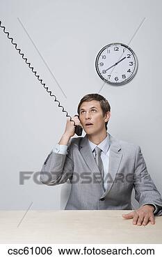 Stock Photo - businessman talking 
on telephone. 
fotosearch - search 
stock photos, 
pictures, images, 
and photo clipart
