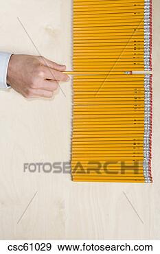 Stock Photograph - hand pulling pencil 
out of row. fotosearch 
- search stock 
photos, pictures, 
images, and photo 
clipart