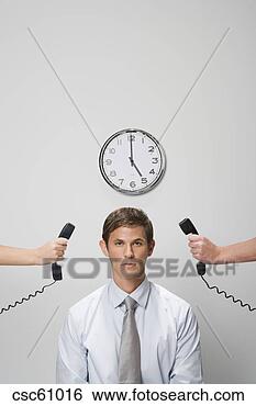 Stock Photo - telephone receivers 
next to businessman’s 
ears. fotosearch 
- search stock 
photos, pictures, 
images, and photo 
clipart
