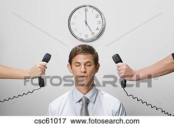 Picture - telephone receivers 
next to businessman’s 
ears. fotosearch 
- search stock 
photos, pictures, 
images, and photo 
clipart