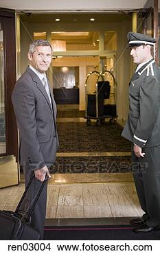 Stock Photo - businessman and 
bellhop in hotel 
doorway. fotosearch 
- search stock 
photos, pictures, 
images, and photo 
clipart
