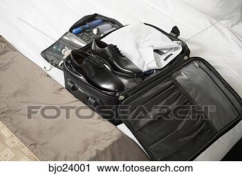 Stock Photography - businessman's 
packed suitcase 
on bed. fotosearch 
- search stock 
photos, pictures, 
images, and photo 
clipart