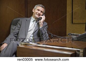 Stock Image - businessman talking 
on telephone. 
fotosearch - search 
stock photos, 
pictures, images, 
and photo clipart