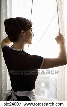 Picture - maid looking out 
window. fotosearch 
- search stock 
photos, pictures, 
images, and photo 
clipart