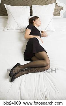 Stock Photograph - maid sleeping 
on bed. fotosearch 
- search stock 
photos, pictures, 
images, and photo 
clipart