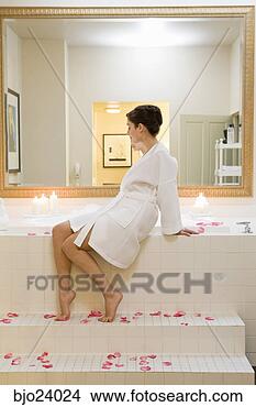 Stock Photo - woman sitting 
next to bubble 
bath. fotosearch 
- search stock 
photos, pictures, 
images, and photo 
clipart