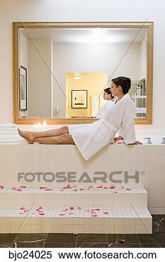 Stock Image - woman sitting 
next to bubble 
bath. fotosearch 
- search stock 
photos, pictures, 
images, and photo 
clipart