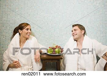 Stock Photography - couple in bathrobes 
smiling at each 
other. fotosearch 
- search stock 
photos, pictures, 
images, and photo 
clipart