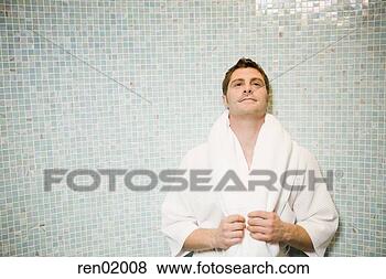 Stock Photo - man in bathrobe 
leaning on tile 
wall. fotosearch 
- search stock 
photos, pictures, 
images, and photo 
clipart