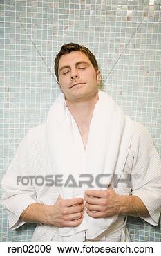 Stock Photograph - man in bathrobe 
leaning on tile 
wall. fotosearch 
- search stock 
photos, pictures, 
images, and photo 
clipart
