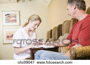 Picture - man receiving 
spa manicure. 
fotosearch - search 
stock photos, 
pictures, images, 
and photo clipart