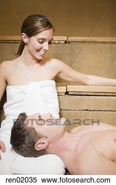 Stock Image - man resting head 
on girlfriend’s 
lap in sauna. 
fotosearch - search 
stock photos, 
pictures, images, 
and photo clipart