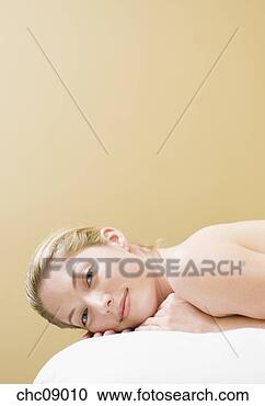 Stock Photography - woman laying on 
massage table. 
fotosearch - search 
stock photos, 
pictures, images, 
and photo clipart
