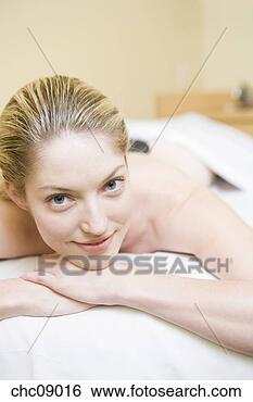 Stock Photo - woman laying on 
massage table. 
fotosearch - search 
stock photos, 
pictures, images, 
and photo clipart