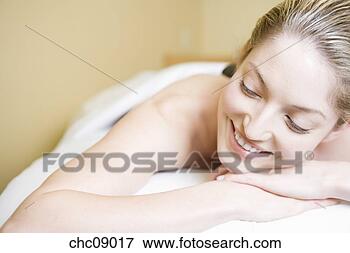 Picture - woman laying on 
massage table. 
fotosearch - search 
stock photos, 
pictures, images, 
and photo clipart