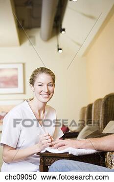 Stock Photography - woman performing 
spa manicure. 
fotosearch - search 
stock photos, 
pictures, images, 
and photo clipart