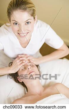 Stock Photo - woman receiving 
facial massage. 
fotosearch - search 
stock photos, 
pictures, images, 
and photo clipart