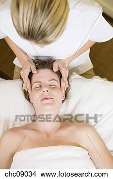 Stock Photo - woman receiving 
facial massage. 
fotosearch - search 
stock photos, 
pictures, images, 
and photo clipart