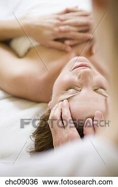 Stock Photo - woman receiving 
facial massage. 
fotosearch - search 
stock photos, 
pictures, images, 
and photo clipart