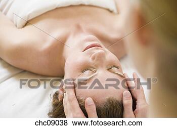 Stock Photo - woman receiving 
facial massage. 
fotosearch - search 
stock photos, 
pictures, images, 
and photo clipart