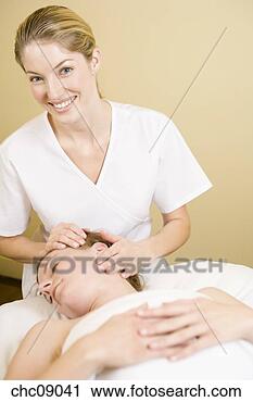 Stock Photography - woman receiving 
facial massage. 
fotosearch - search 
stock photos, 
pictures, images, 
and photo clipart