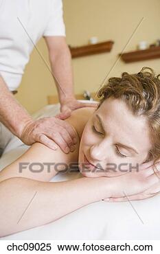 Stock Image - woman receiving 
massage. fotosearch 
- search stock 
photos, pictures, 
images, and photo 
clipart