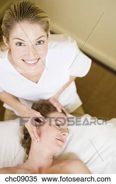 Stock Image - woman receiving 
massage. fotosearch 
- search stock 
photos, pictures, 
images, and photo 
clipart