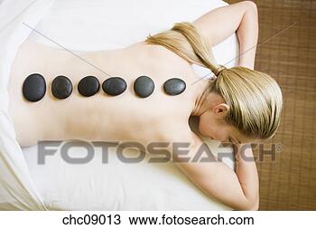 Stock Photo - woman receiving 
spa stone treatment. 
fotosearch - search 
stock photos, 
pictures, images, 
and photo clipart