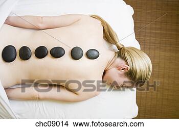 Stock Photo - woman receiving 
spa stone treatment. 
fotosearch - search 
stock photos, 
pictures, images, 
and photo clipart