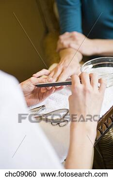 Stock Photography - woman receiving 
spa manicure. 
fotosearch - search 
stock photos, 
pictures, images, 
and photo clipart