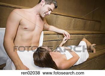 Stock Photo - woman resting 
head on boyfriend’s 
lap in sauna. 
fotosearch - search 
stock photos, 
pictures, images, 
and photo clipart