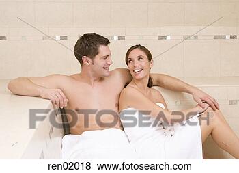 Stock Photo - young couple sitting 
in sauna. fotosearch 
- search stock 
photos, pictures, 
images, and photo 
clipart