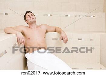 Picture - young man sitting 
in sauna. fotosearch 
- search stock 
photos, pictures, 
images, and photo 
clipart