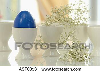 Stock Photography - blue easter egg 
in a egg cup, 
close-up. fotosearch 
- search stock 
photos, pictures, 
images, and photo 
clipart