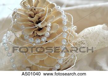 Stock Photography - christmas decoration 
with fir cone 
and pearl string, 
close-up. fotosearch 
- search stock 
photos, pictures, 
images, and photo 
clipart