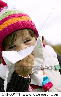 Stock Photography - girl (4-5) blowing 
nose, close-up. 
fotosearch - search 
stock photos, 
pictures, images, 
and photo clipart