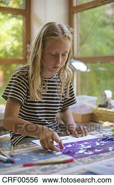 Stock Photo - girl using stencil 
for drawing. fotosearch 
- search stock 
photos, pictures, 
images, and photo 
clipart