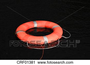 Stock Photography - life preserver 
floating on water, 
close-up. fotosearch 
- search stock 
photos, pictures, 
images, and photo 
clipart