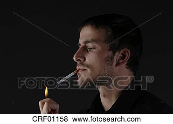 Stock Photo - man lighting a 
cigarette, portrait. 
fotosearch - search 
stock photos, 
pictures, images, 
and photo clipart